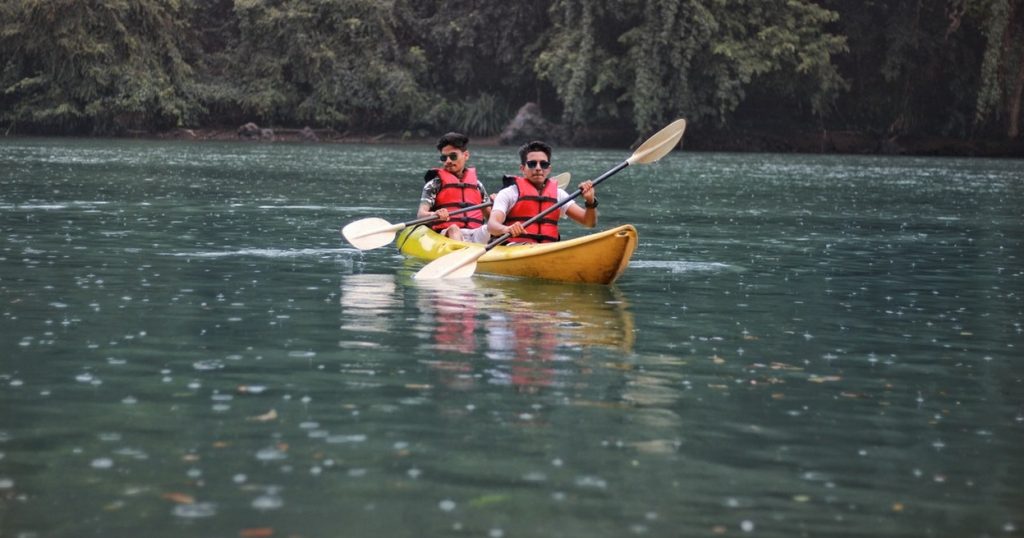 two person kayaking on calm water